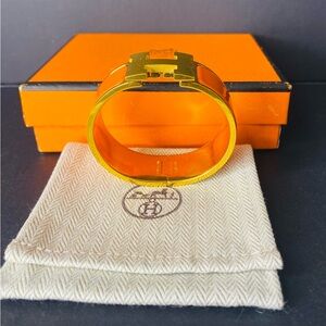 HERMES Signature Orange Enamel and Gold Plated Clic-Clac H GM Wide Bracelet